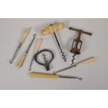 Three vintage corkscrews and five Victorian button hooks