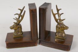 A C19th pair of carved wood and bronze stag head bookends, 5" high