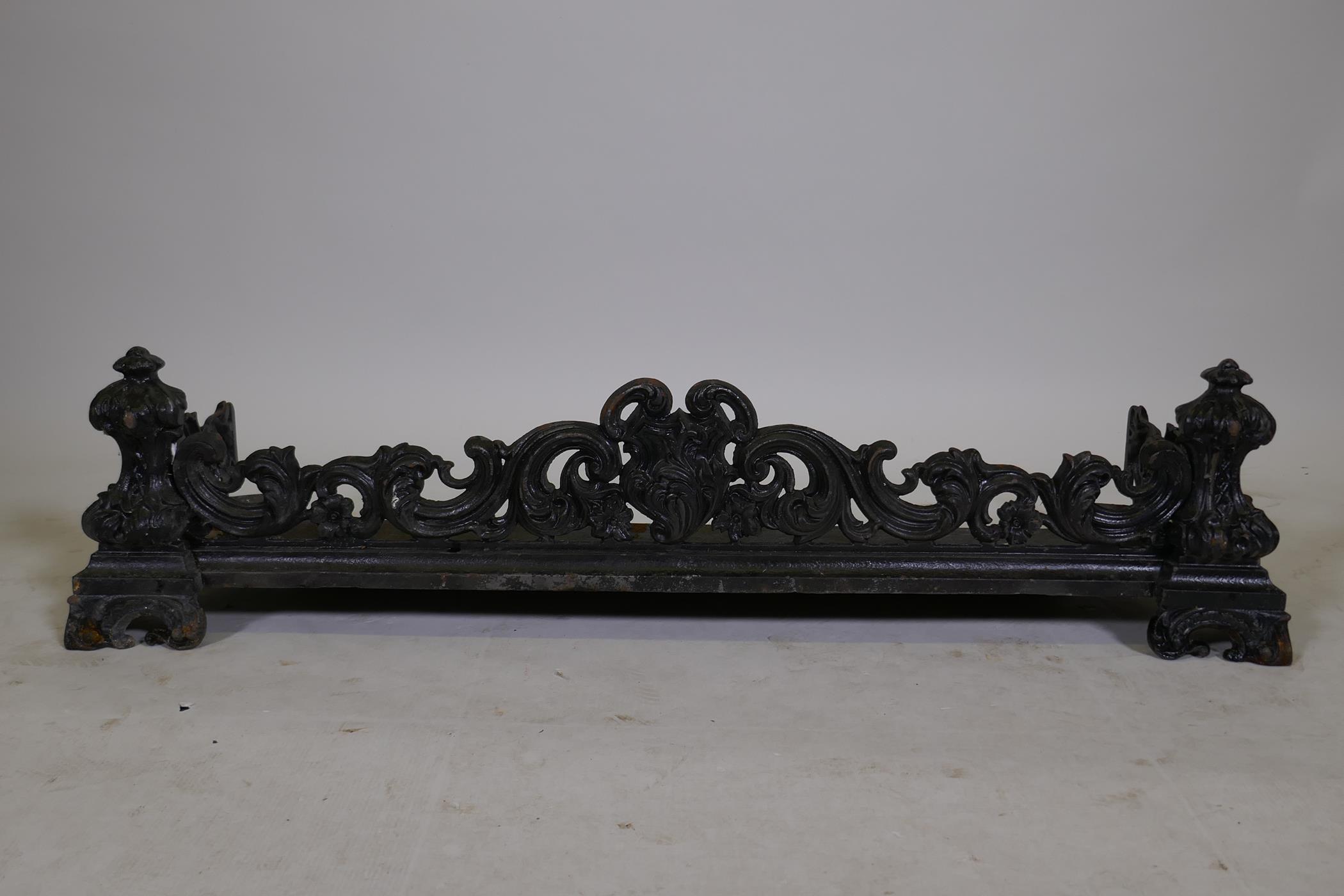 A Victorian cast iron fire surround with Rococo style decoration, 41" x 12" x 10"