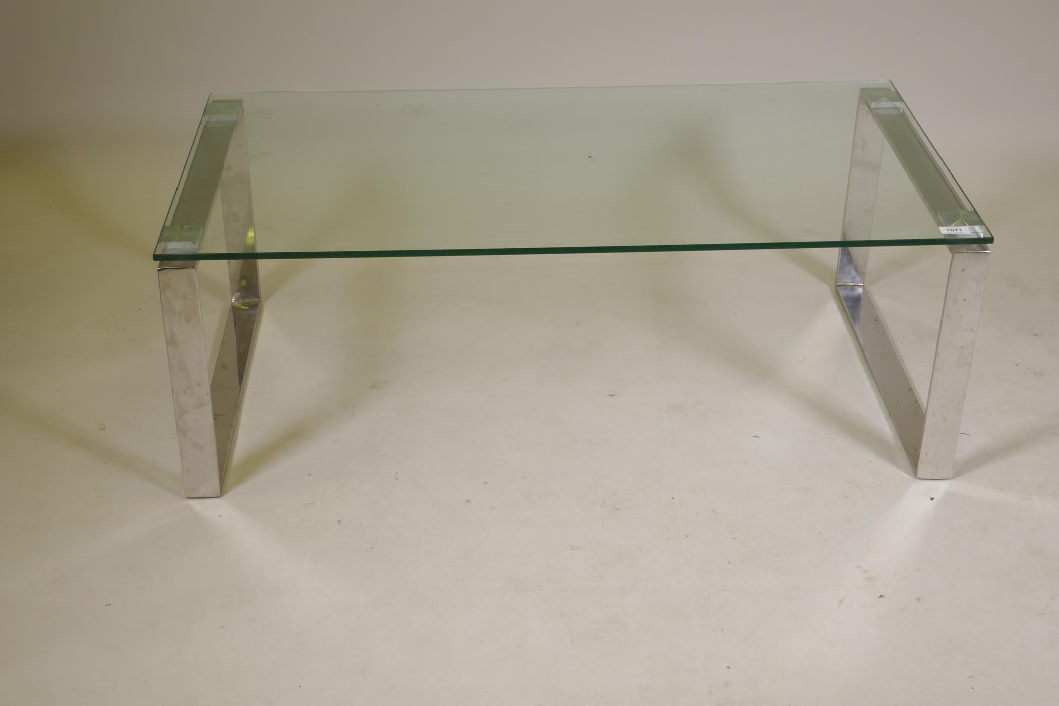 A designer glass topped coffee table on chrome end supports, 43" x 23½", 15" high - Image 2 of 2