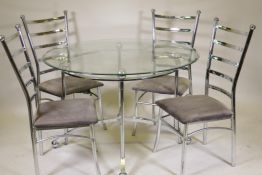 A contemporary glass top dining table raised on a chrome metal base, and four chairs ensuite