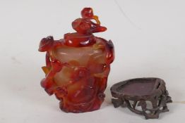 A Chinese carved agate jar and cover, on a hardwood stand, 4" high, stand AF