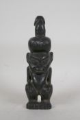 An African carved hardstone fertility figure, 10" high