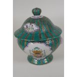 A Continental porcelain jar and cover with panels decorated with coats of arms, on a green and