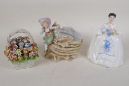 A Sitzendorf porcelain posey basket formed as a child seated on a shell, a Royal Doulton