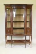 A Victorian Adam style mahogany display cabinet, with carved and moulded frieze over a single bow