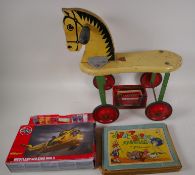 A Triang wood and metal horse on wheels, 17" high, the 'Japhet and Happy' Annuyal on Airfix Westland