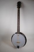 A Martin Smith six string guitar neck banjo with rosewood finger board and Remo banjo skin, 38½"