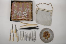 A collection of antique button hooks with hallmarked silver, mother of pearl and ivory handles,
