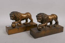 A pair of lacquered white metal bookends in the form of lions, mounted on pedestal bases, 8" x 5"