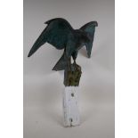 A bronzed composition model of a kestrel with verdigris patination, 14½" high excluding mount