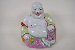 A Chinese porcelain figure of a laughing Buddha, 12" high