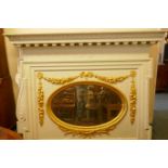 Architectural salvage, a large painted pine overmantel mirror with carved and gilded decoration,