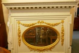 Architectural salvage, a large painted pine overmantel mirror with carved and gilded decoration,