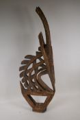 An African carved wood stylised antelope, 33½" high