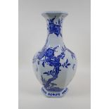A blue and white porcelain hexagonal vase, decorated with a peach tree and bats, Chinese Qianlong
