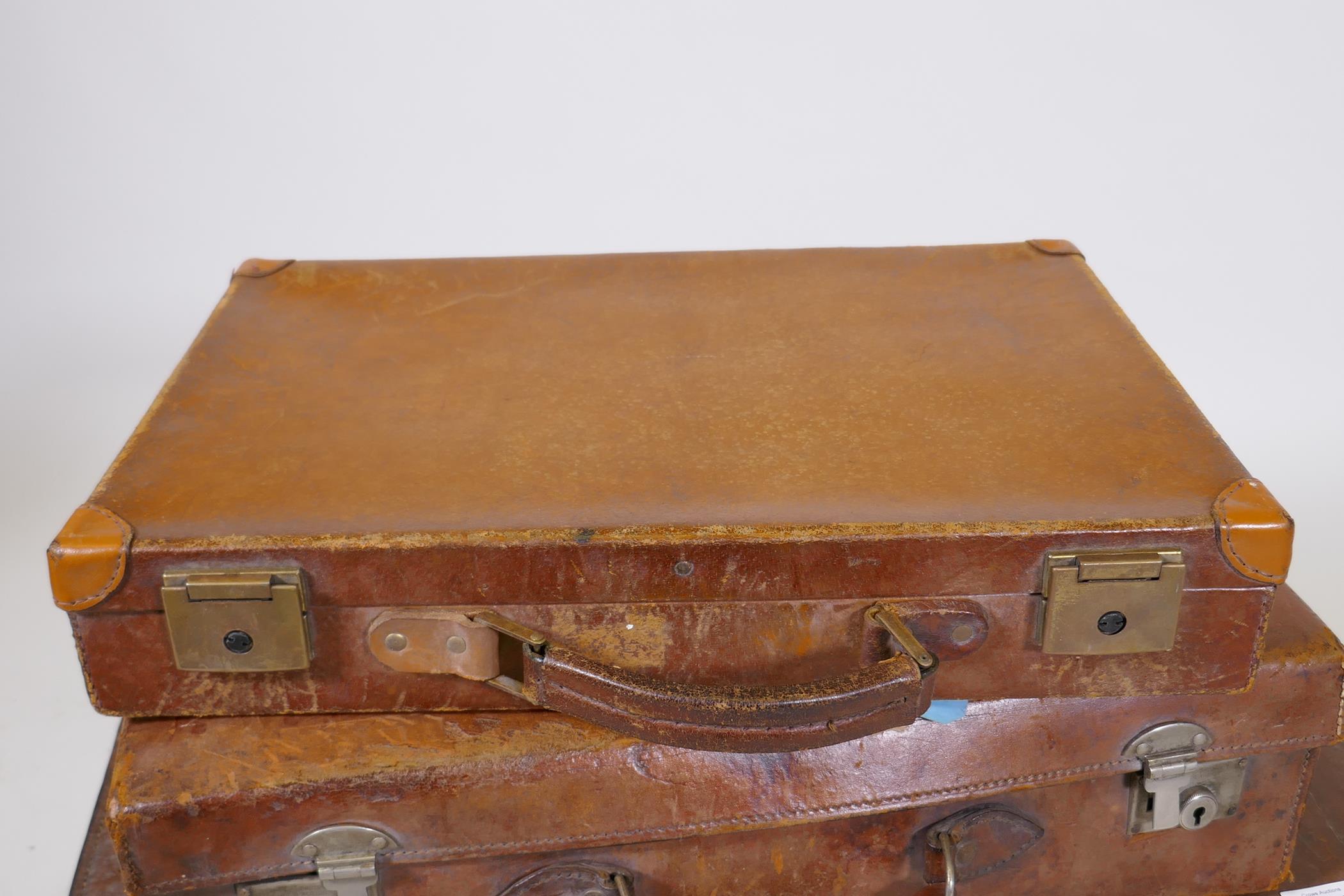 A vintage leather suitcase by R.W. Forsyth, a smaller leather case and an attache case, 26" x 16" - Image 2 of 9