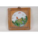 A Chinese KangXi style famille vert porcelain plaque depicting a kylin, in a hardwood frame, 9½" x