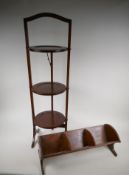 An Edwardian inlaid mahogany three tier folding cake stand and an oak four section book trough,