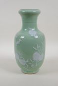 A celadon glazed porcelain vase with raised peach and bat decoration, Chinese Qianlong seal mark
