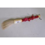 A Chinese paint brush with coral and bone handle, 11" long