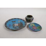 A Chinese cloisonne enamel pot with lotus flower decoration, a cloisonne saucer with butterfly