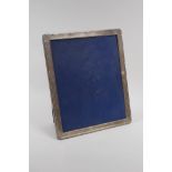 A late C20th hallmarked silver easel photo frame, 9½" x 11½"