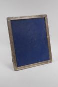 A late C20th hallmarked silver easel photo frame, 9½" x 11½"