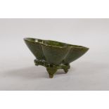 A Chinese stoneware and porcelain green glazed leaf dish, 4" x 3½"