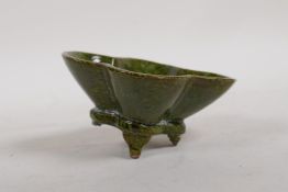 A Chinese stoneware and porcelain green glazed leaf dish, 4" x 3½"