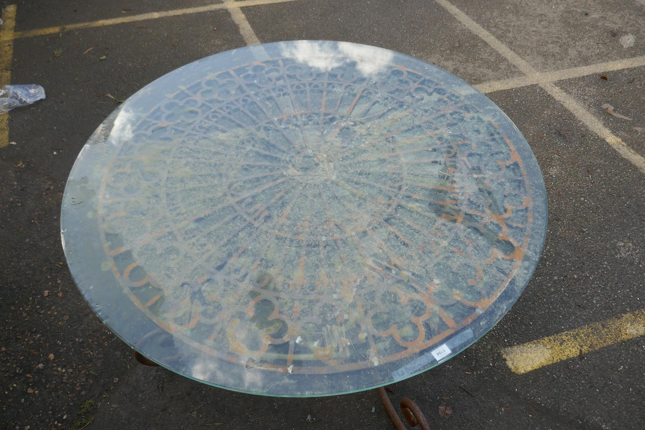 A wrought iron garden / conservatory table with plate glass top, 53" diameter, 30" high - Image 2 of 2