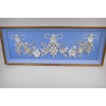 A shell picture of a floral garland and fairies, 38" x 13½"