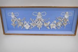 A shell picture of a floral garland and fairies, 38" x 13½"