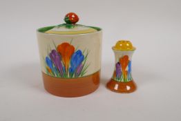 A Clarice Cliff Bizarre Crocus pattern, hand painted pottery jam pot and a matching pepper pot,