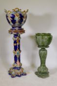 A Victorian majolica jardiniere and stand, stand 35" high, and a similar in green glaze