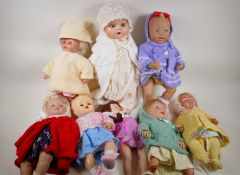 A quantity of baby dolls, largest 22" high