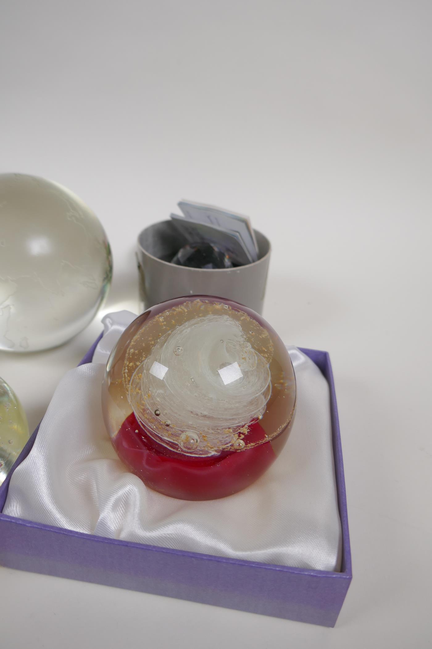 Four glass paperweights, two etched, glass world globes and two Swarovski faceted crystal weights - Image 4 of 4