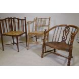 An antique bow back Windsor chair with carved and pierced back splat and elm saddle seat, raised
