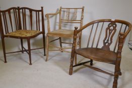 An antique bow back Windsor chair with carved and pierced back splat and elm saddle seat, raised