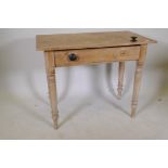 A Victorian stipped pine side table with single drawer, raised on turned supports, 34" x 19" x 27"