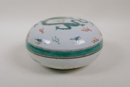 A Chinese late C19th/early C20th famille vert porcelain box and cover with dragon and flaming