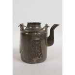 An antique Chinese pewter tea pot with applied decorative panels in relief and removable infuser/