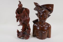 A Japanese hardwood carving of a fisherman, and a Balinese hardwood carving of a man in