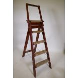 An antique painted pine step ladder, 60" high