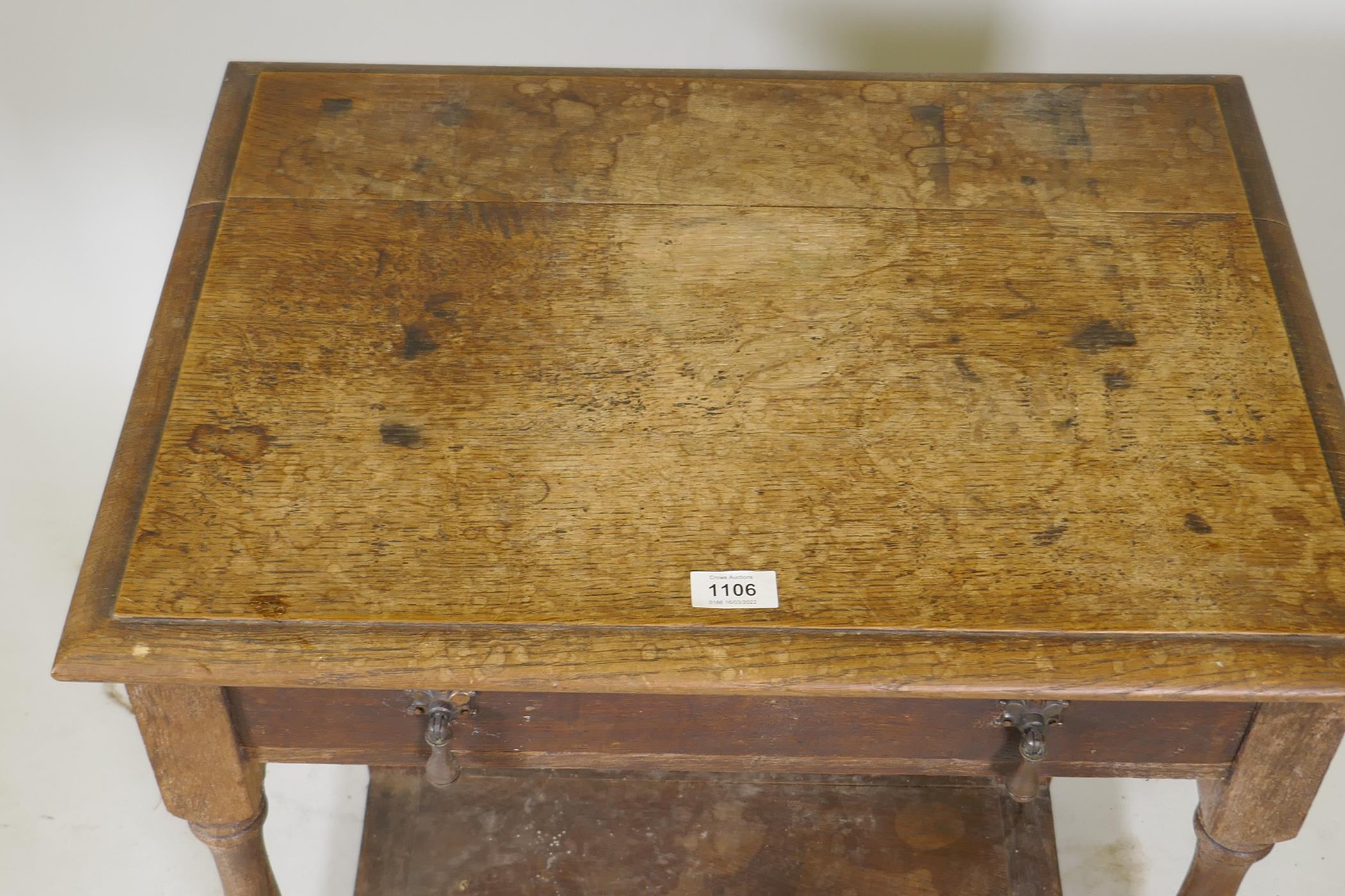 A C19th oak single drawer side table, raised on turned supports with a pot board, 24" x 18" x 29" - Image 2 of 3