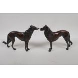 A pair of bronze figures of hounds, 6½" high