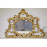 A giltwood rococo style over mantel wall mirror, mid/late C20th, 65" x 46"