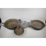 Four Indian graduated bronze cooking pans, largest 15" diameter
