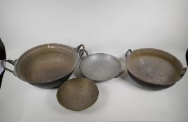 Four Indian graduated bronze cooking pans, largest 15" diameter