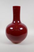 A sang de boeuf glazed porcelain vase, Chinese KangXi 6 character mark to base, 13" high